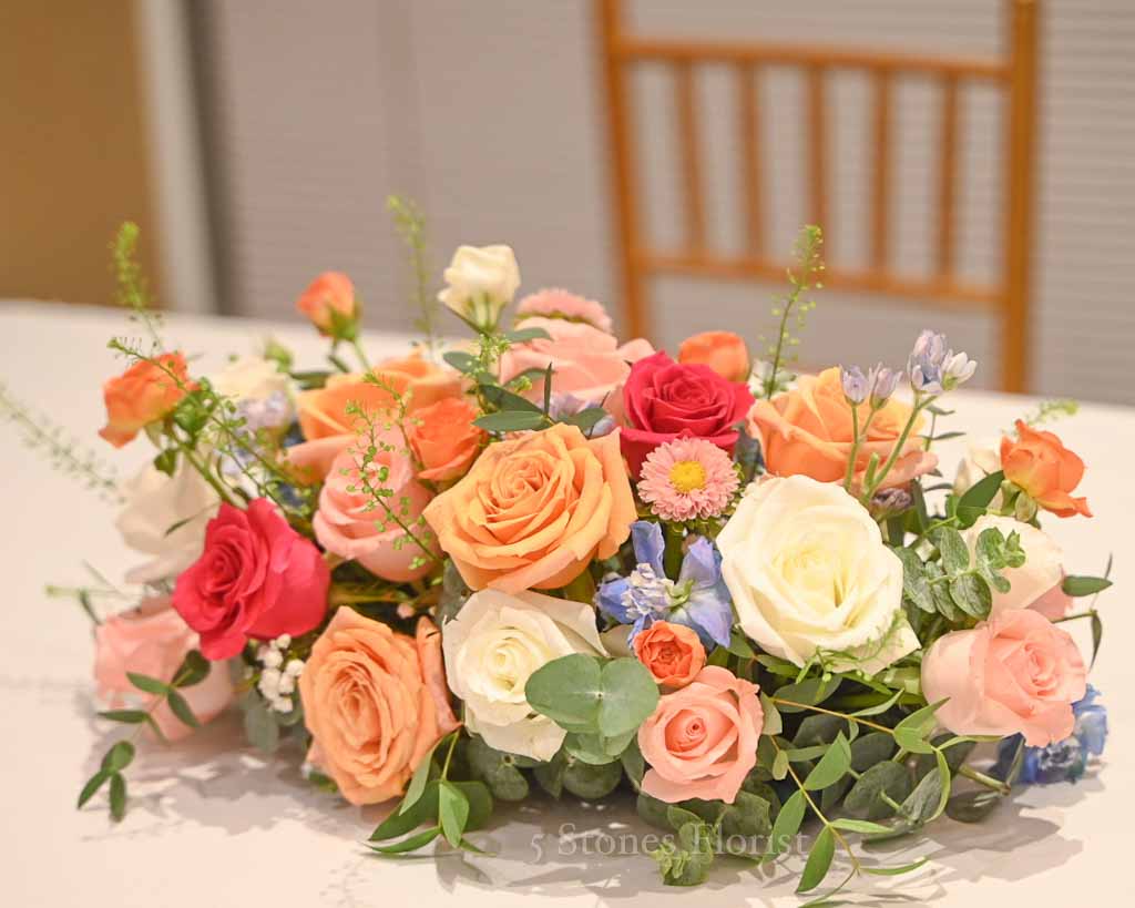 Colourful spring wedding floral at Grace Baptist Church